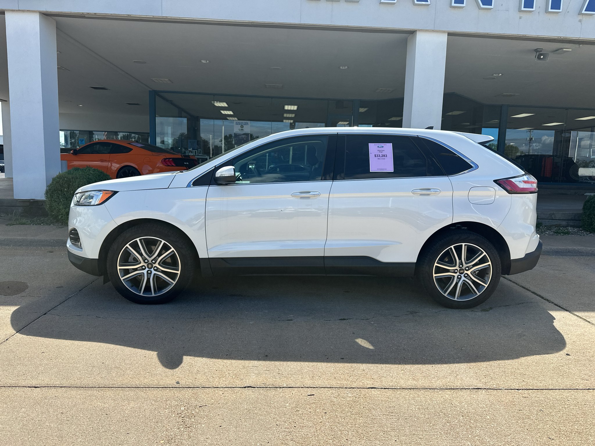Used 2024 Star White Metallic Tri-Coat Ford Titanium image 12