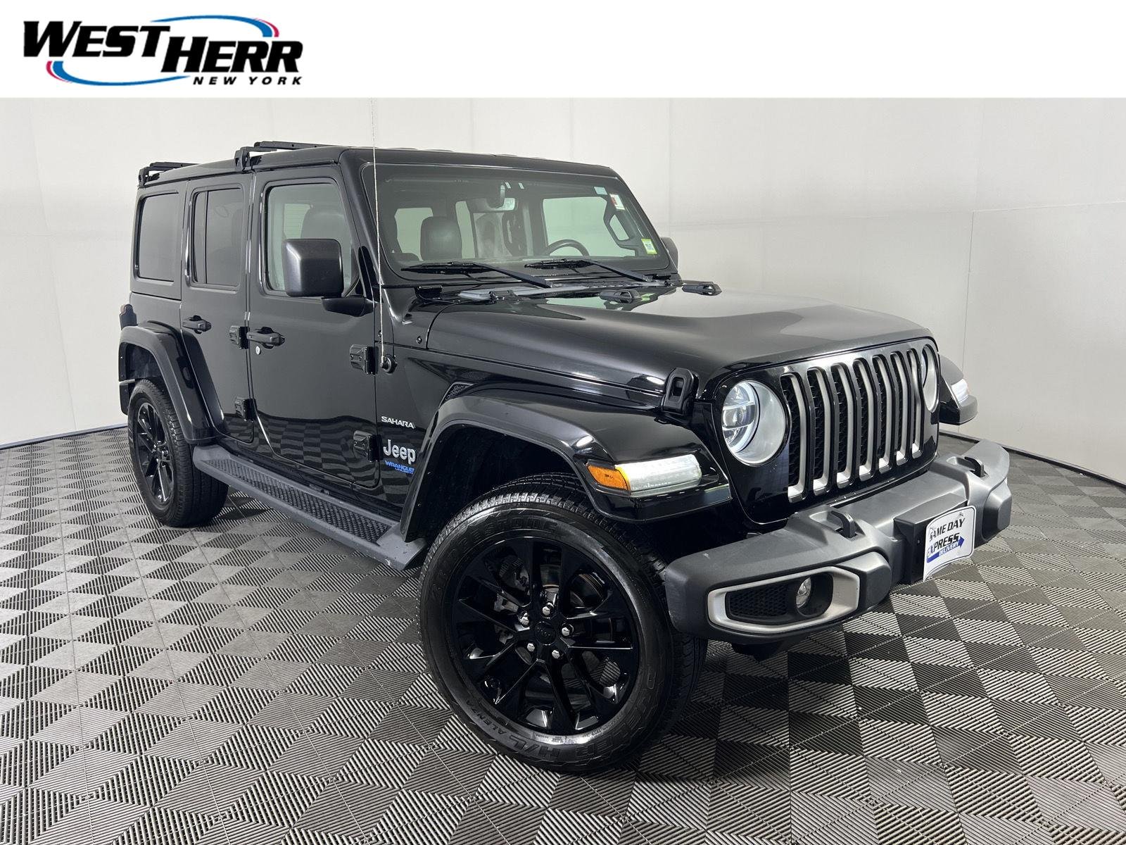 Used 2021 Black Clearcoat Jeep Unlimited Sahara 4xe image 1