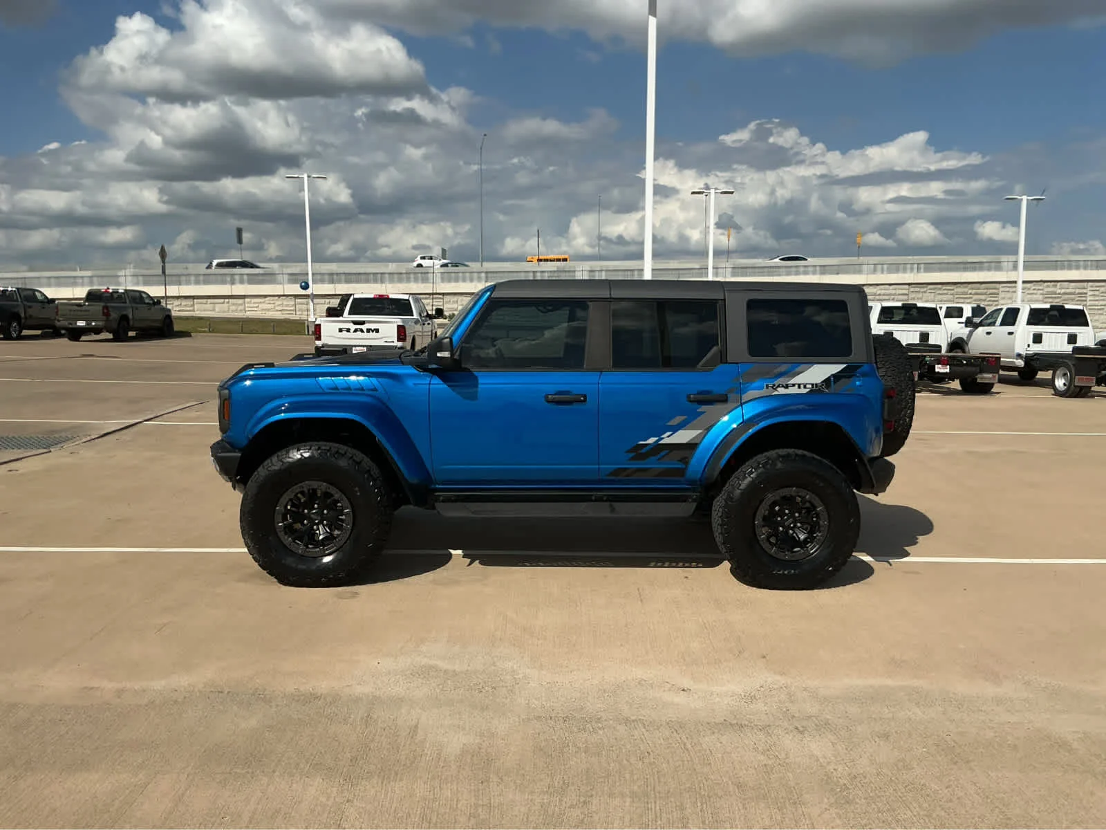 Used 2024 Velocity Blue Metallic Ford Raptor image 9
