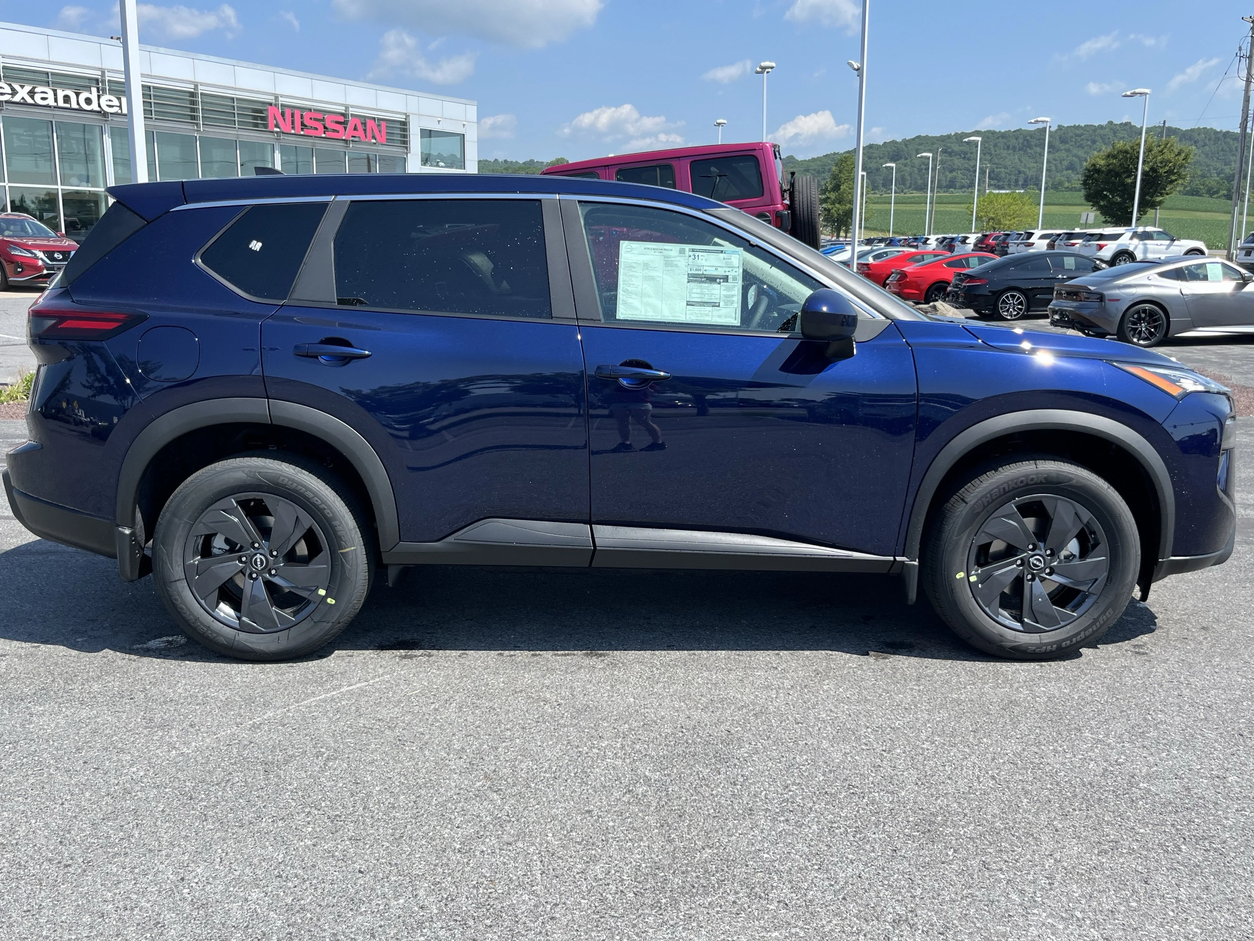 New 2026 Deep Ocean Blue Pearl Nissan SV image 2
