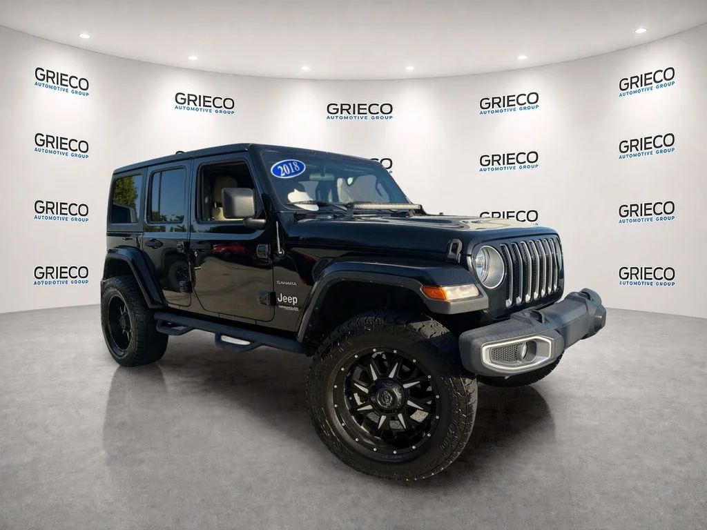Used 2018 Black Clearcoat Jeep Unlimited Sahara image 1