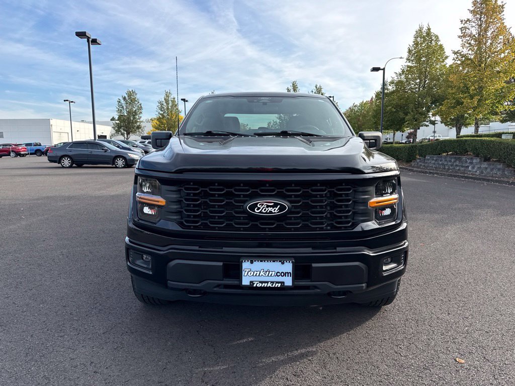 Used 2025 Agate Black Metallic Ford STX image 2