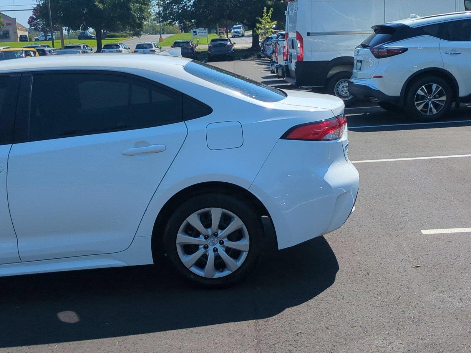 Used 2021 Super White Toyota LE image 11
