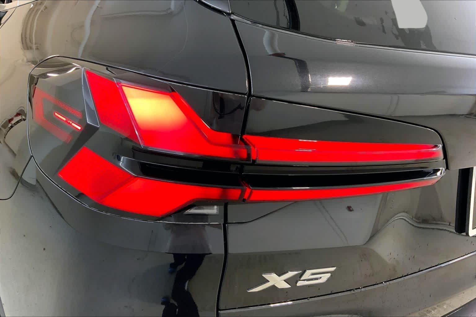 New 2026 Black Sapphire Metallic BMW xDrive50e image 14