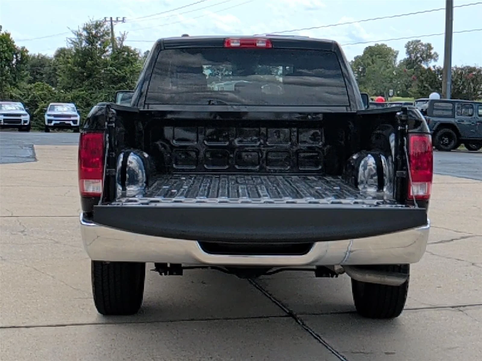 Used 2024 Diamond Black Crystal Pearlcoat Ram SLT image 5