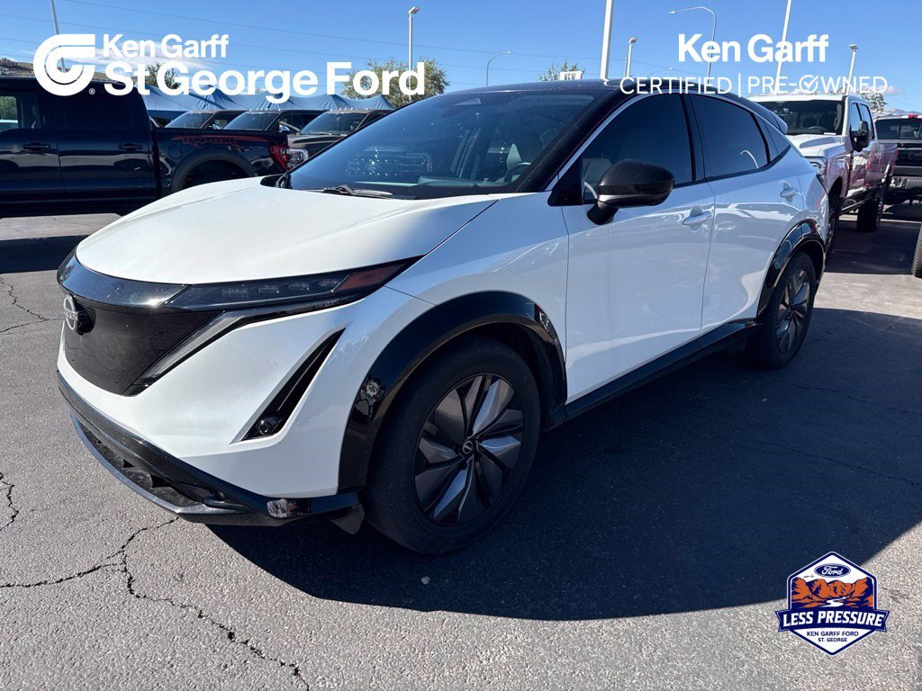 Used 2023 Everest White Pearl Tricoat/Black Diamond Pearl Nissan EVOLVE+ image 1