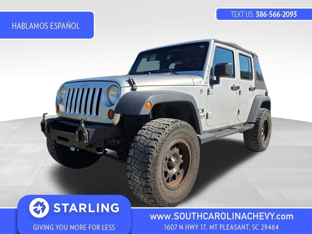 Used 2009 Silver Jeep X image 1