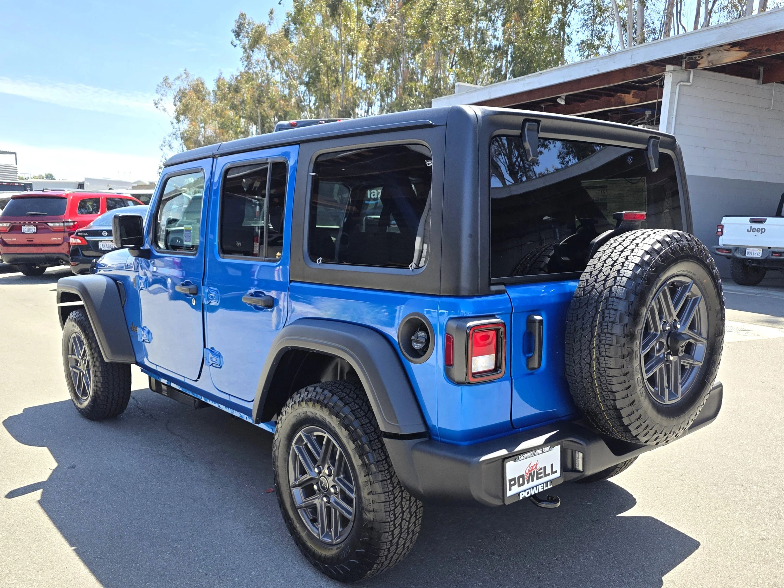 New 2026 Blue Pearl Jeep Sport S image 3