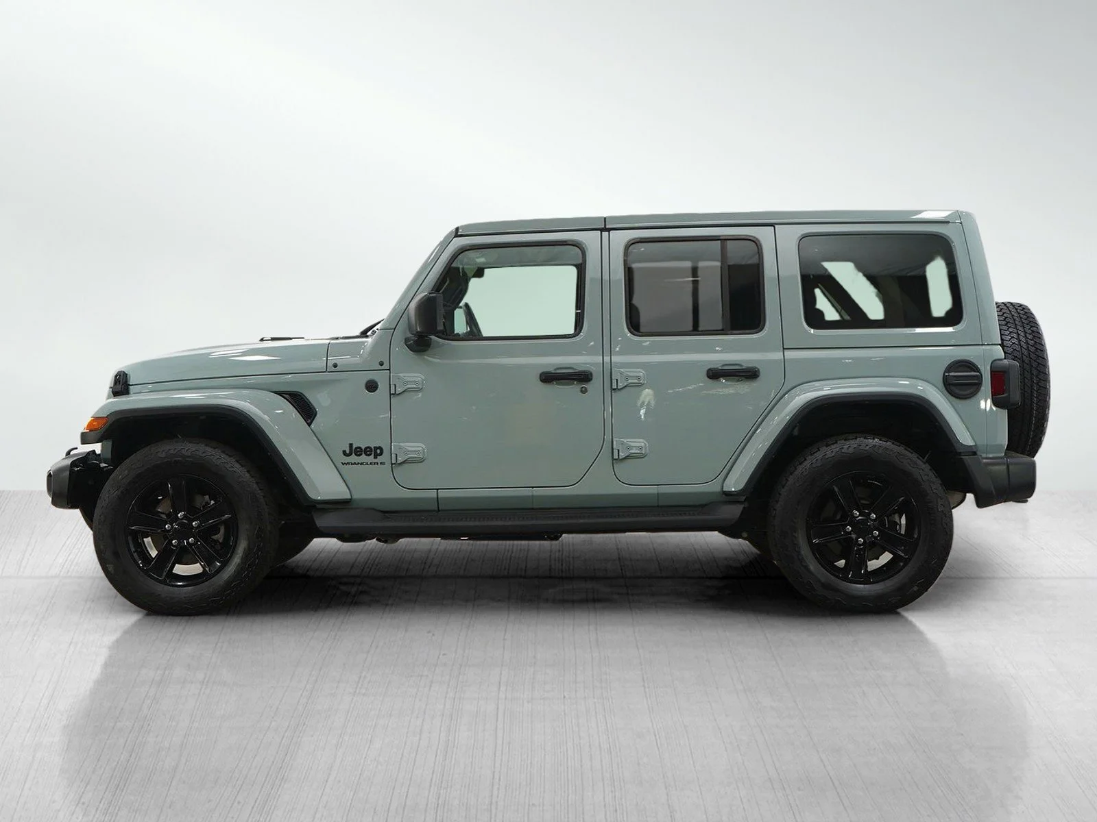 Used 2023 Jeep Wrangler 4-Door Sahara Altitude with VIN 1C4HJXEG9PW634767 for sale in Hopkins, Minnesota