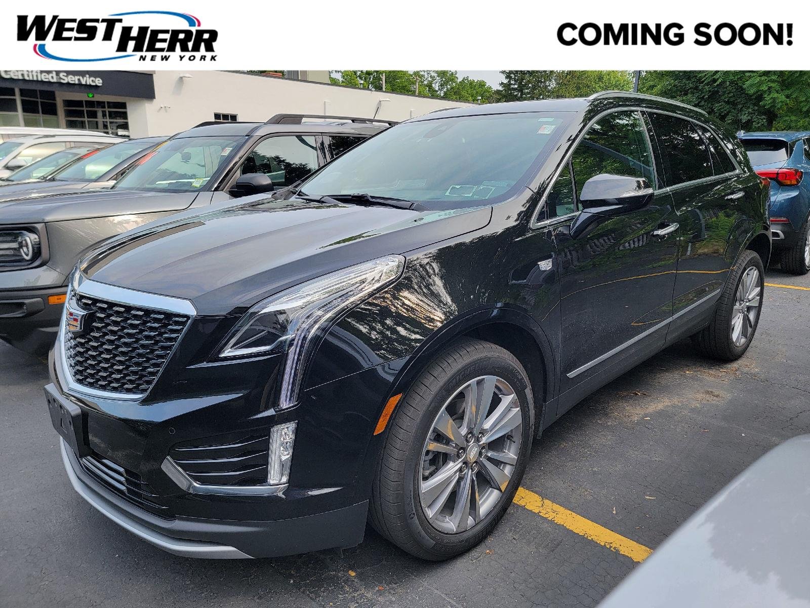 Used 2024 Stellar Black Metallic Cadillac AWD Premium Luxury image 1
