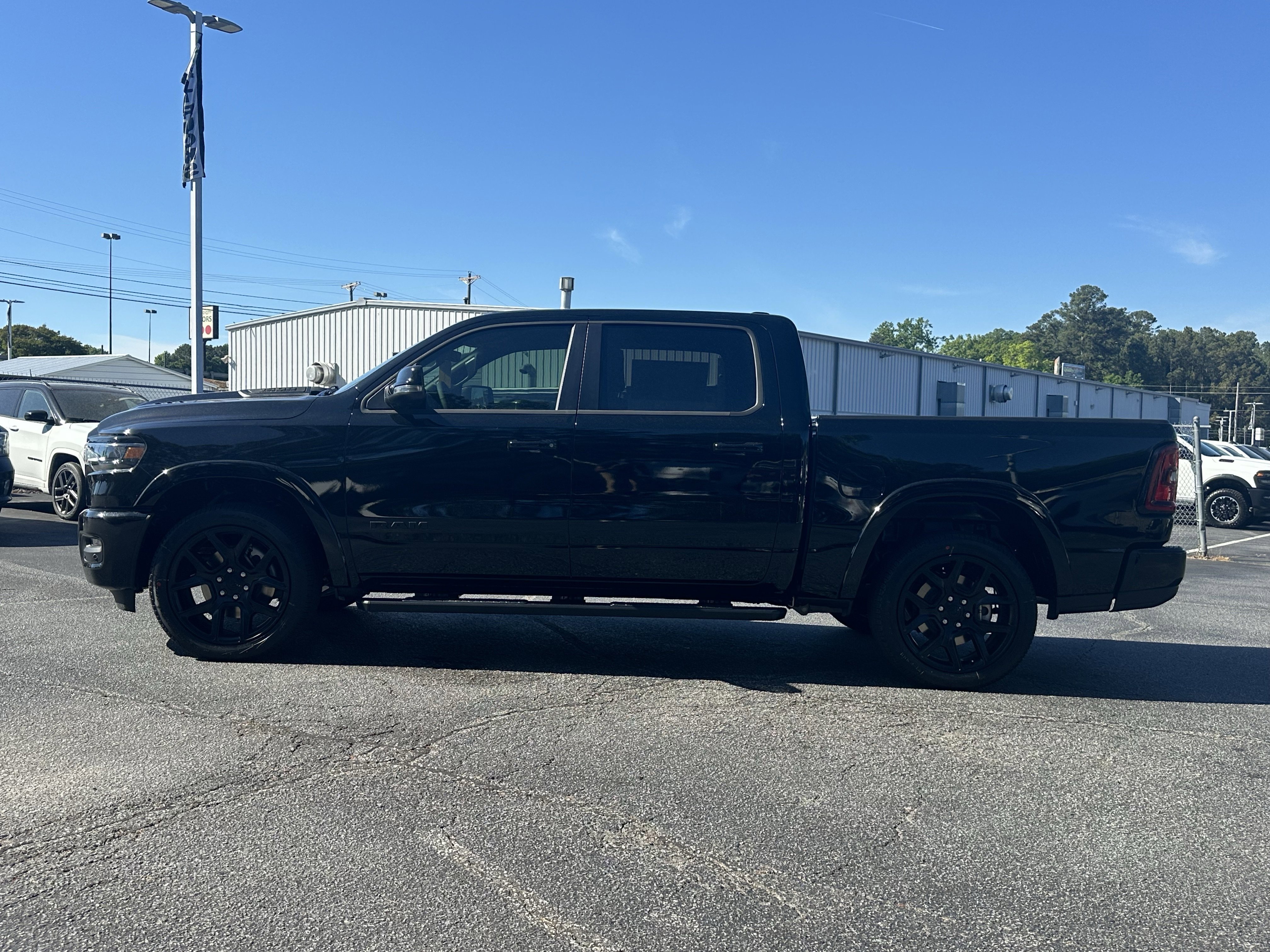 New 2026 Diamond Black Crystal Pearl-Coat Exterior Paint RAM Laramie image 5