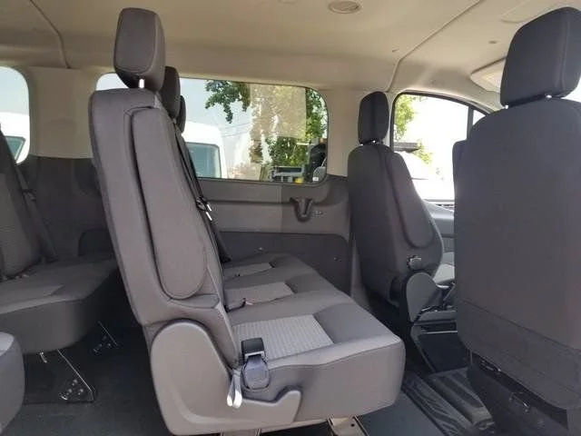 New 2026 Oxford White Ford Passenger Van XLT image 6