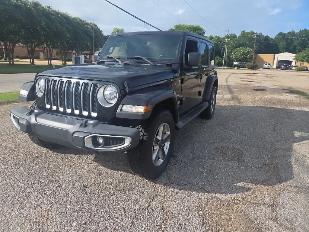 Used 2018 Black Jeep Unlimited Sahara image 4