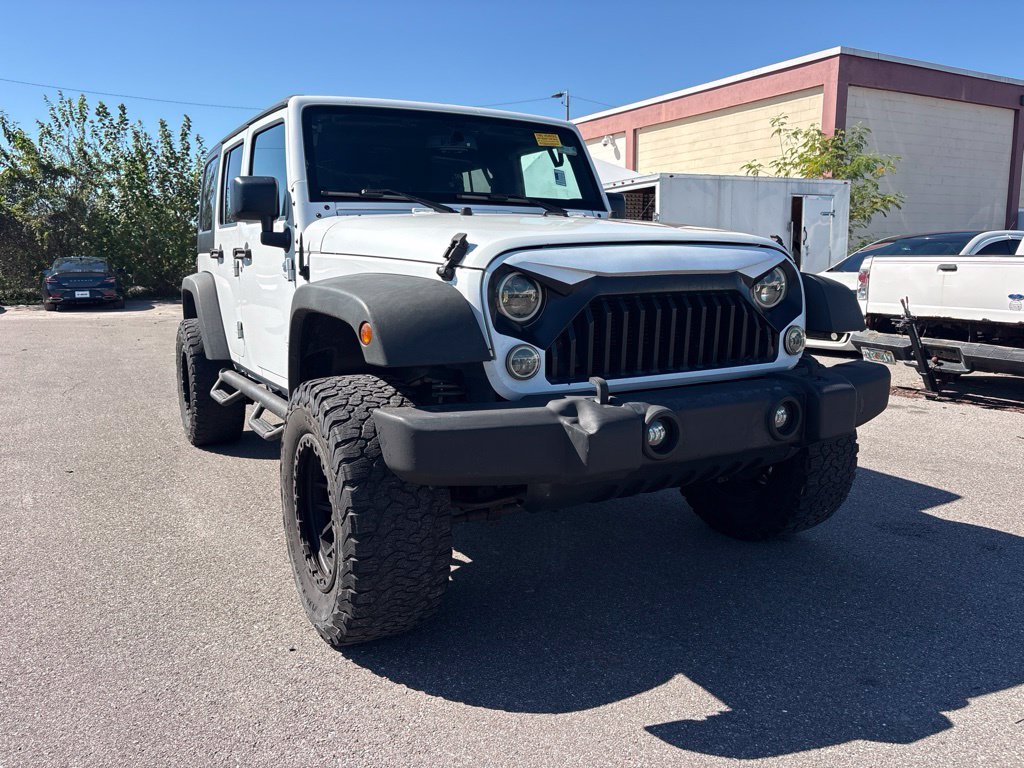 Used 2016 White Jeep Unlimited Sport image 1