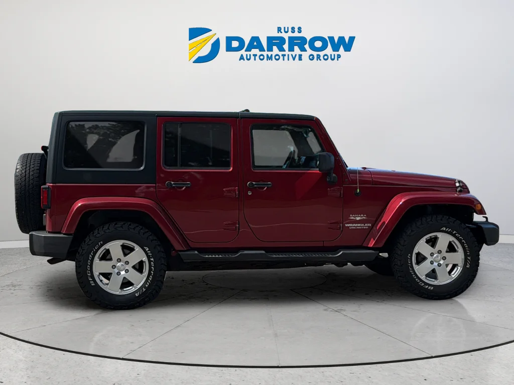 Used 2012 Red Jeep Unlimited Sahara image 6