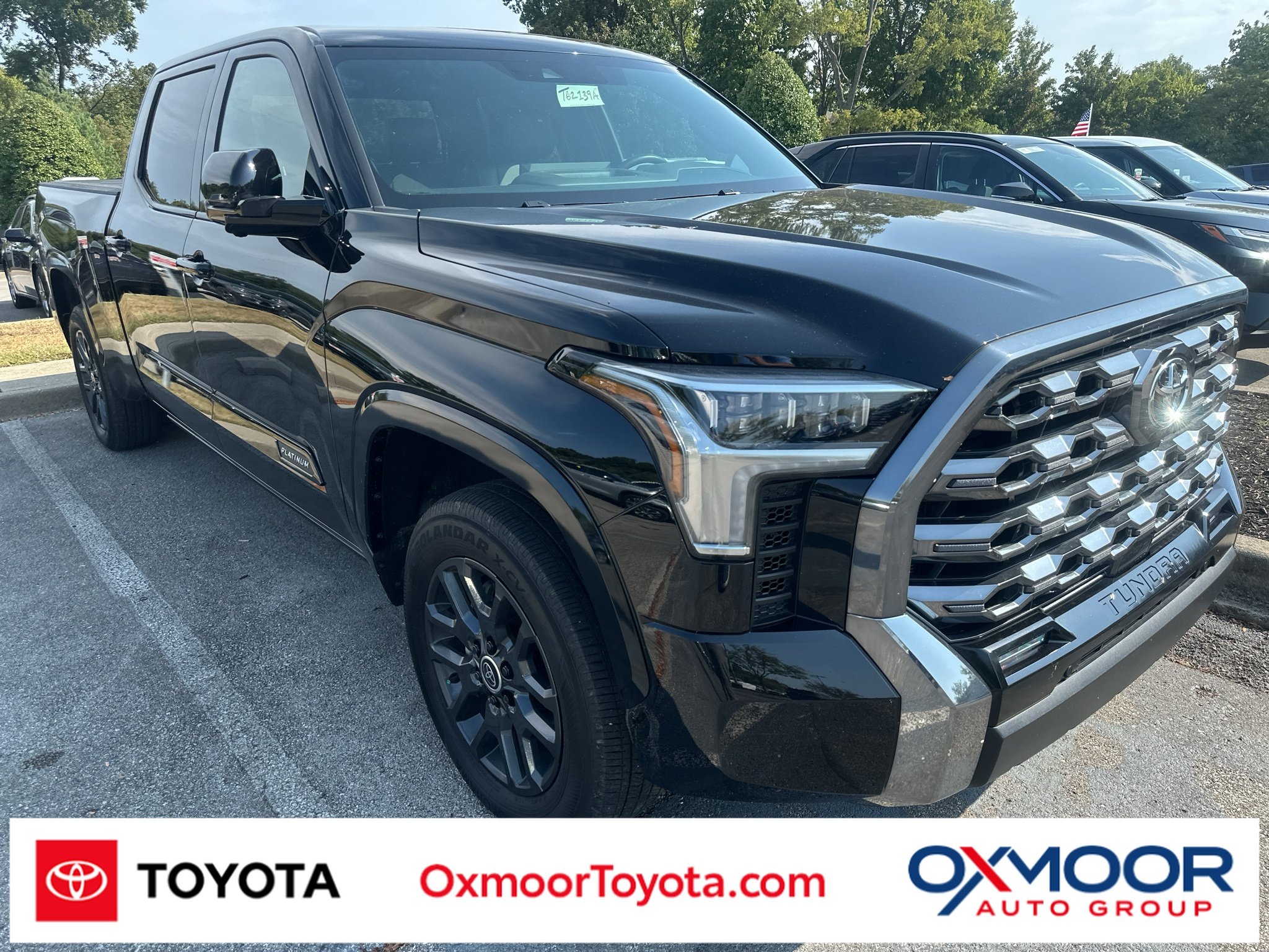 Used 2024 Midnight Black Metallic Toyota Platinum image 1