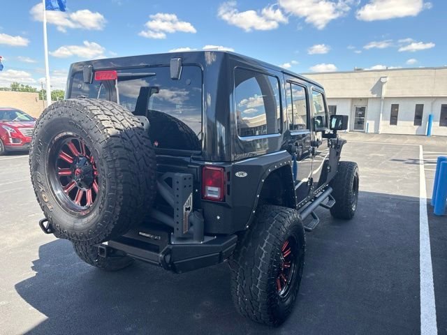Used 2013 Black Jeep Unlimited Sahara image 7