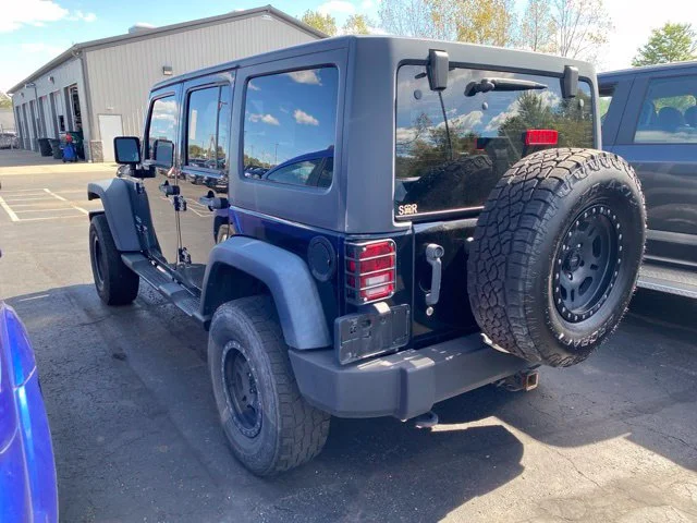 Used 2013 Black Jeep Unlimited Sport image 4