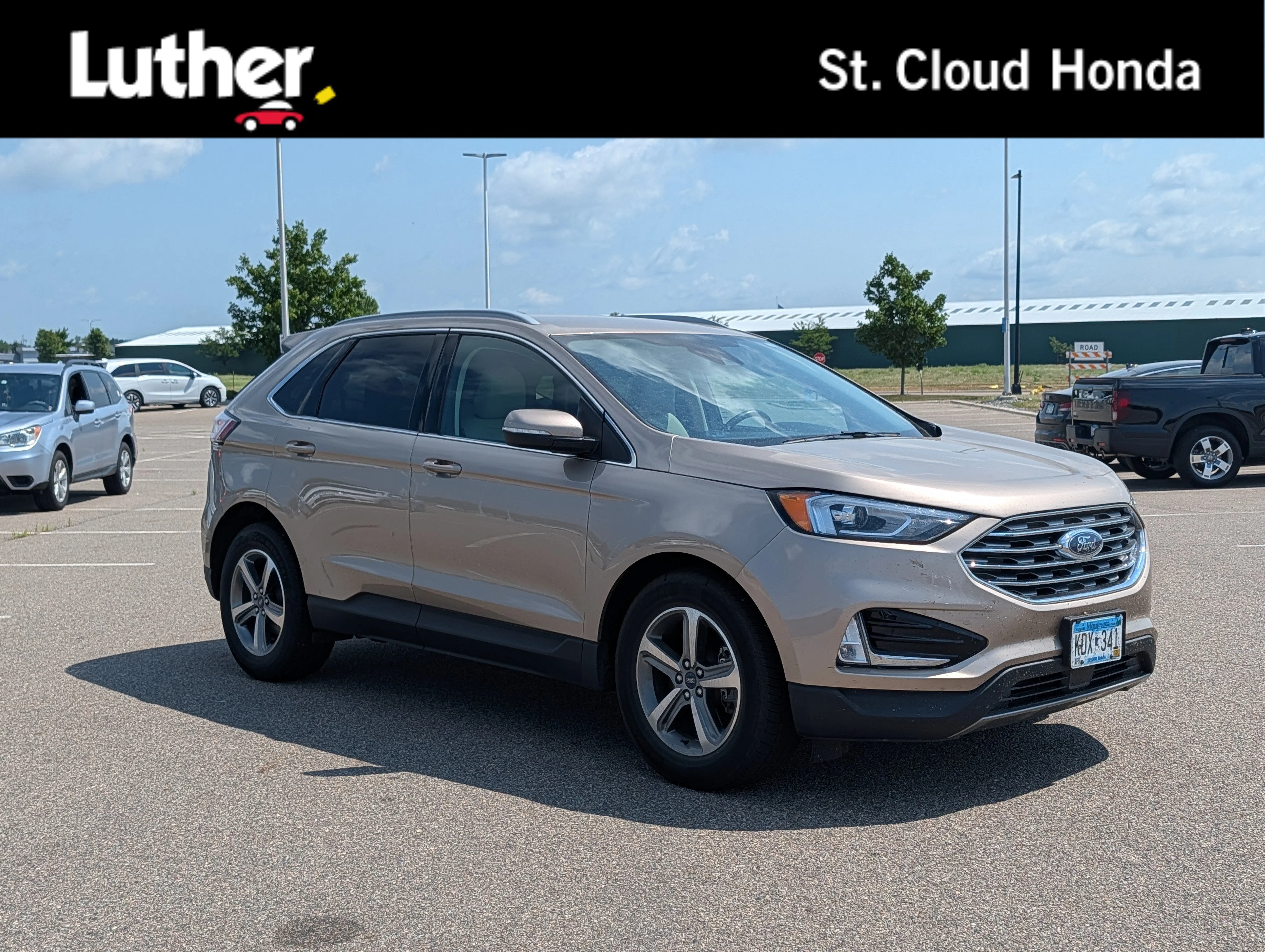 Used 2020 Desert Gold Metallic Ford SEL image 1