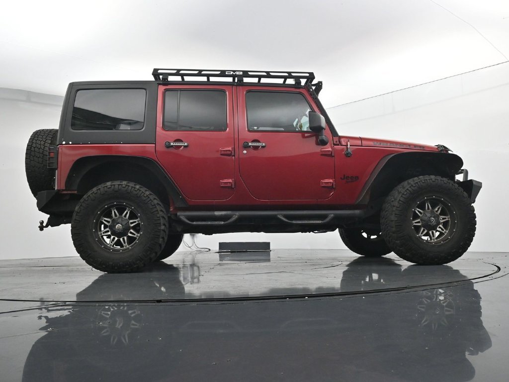 Used 2012 Red Jeep Unlimited Sport image 24