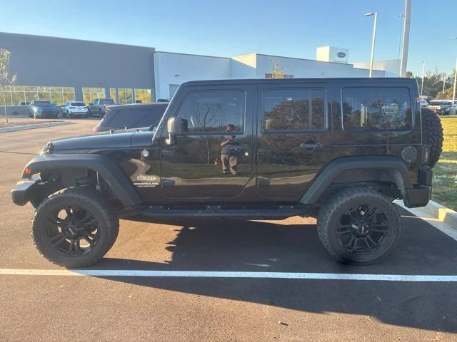 Used 2015 Black Jeep Unlimited Sport image 4