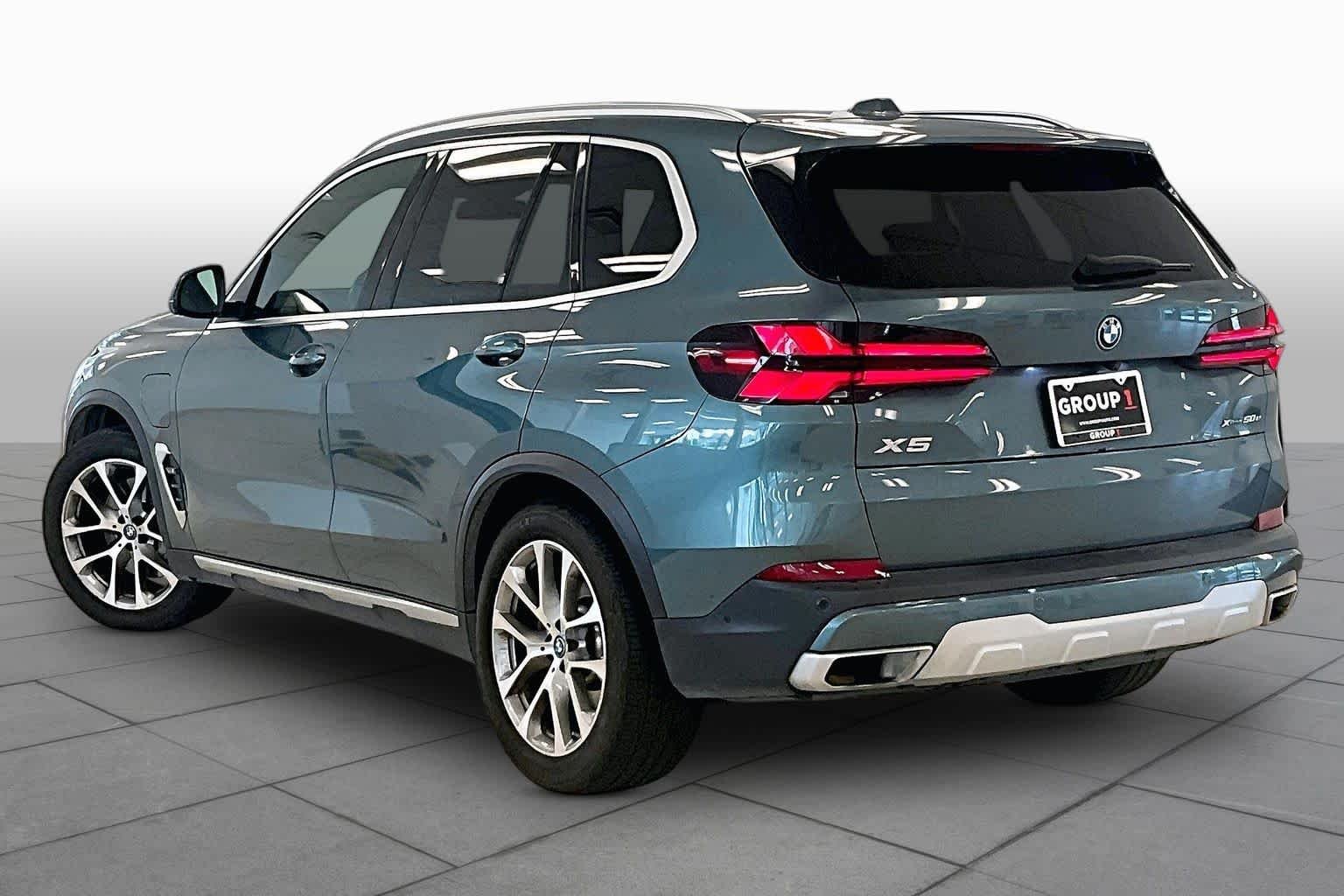Used 2024 Blue Ridge Mountain Metallic BMW xDrive50e image 11