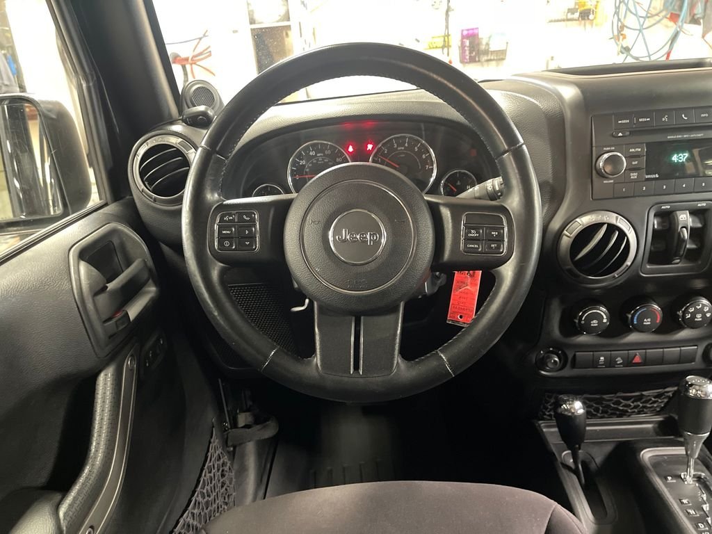 Used 2013 Black Jeep Unlimited Sport image 17