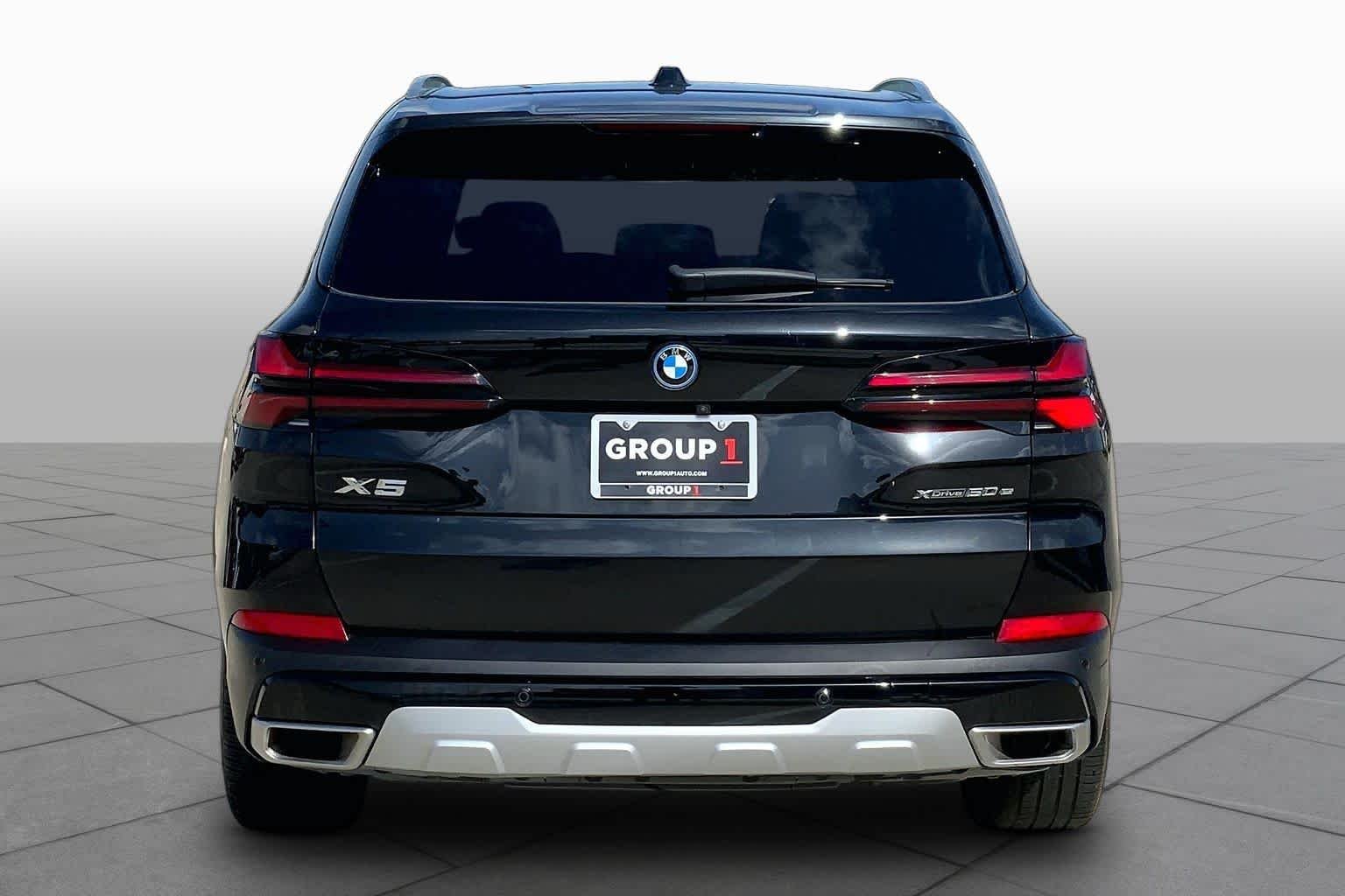Used 2025 Black Sapphire Metallic BMW xDrive50e image 5