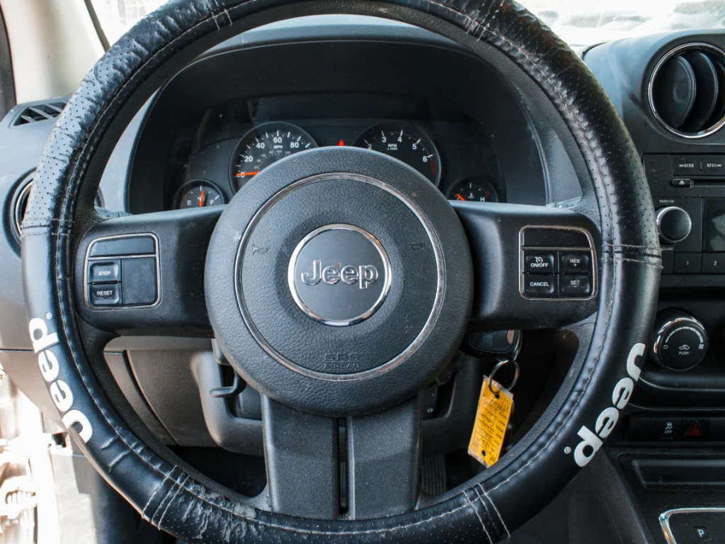 Used 2012 Bright Silver Metallic Clearcoat Jeep Sport image 9