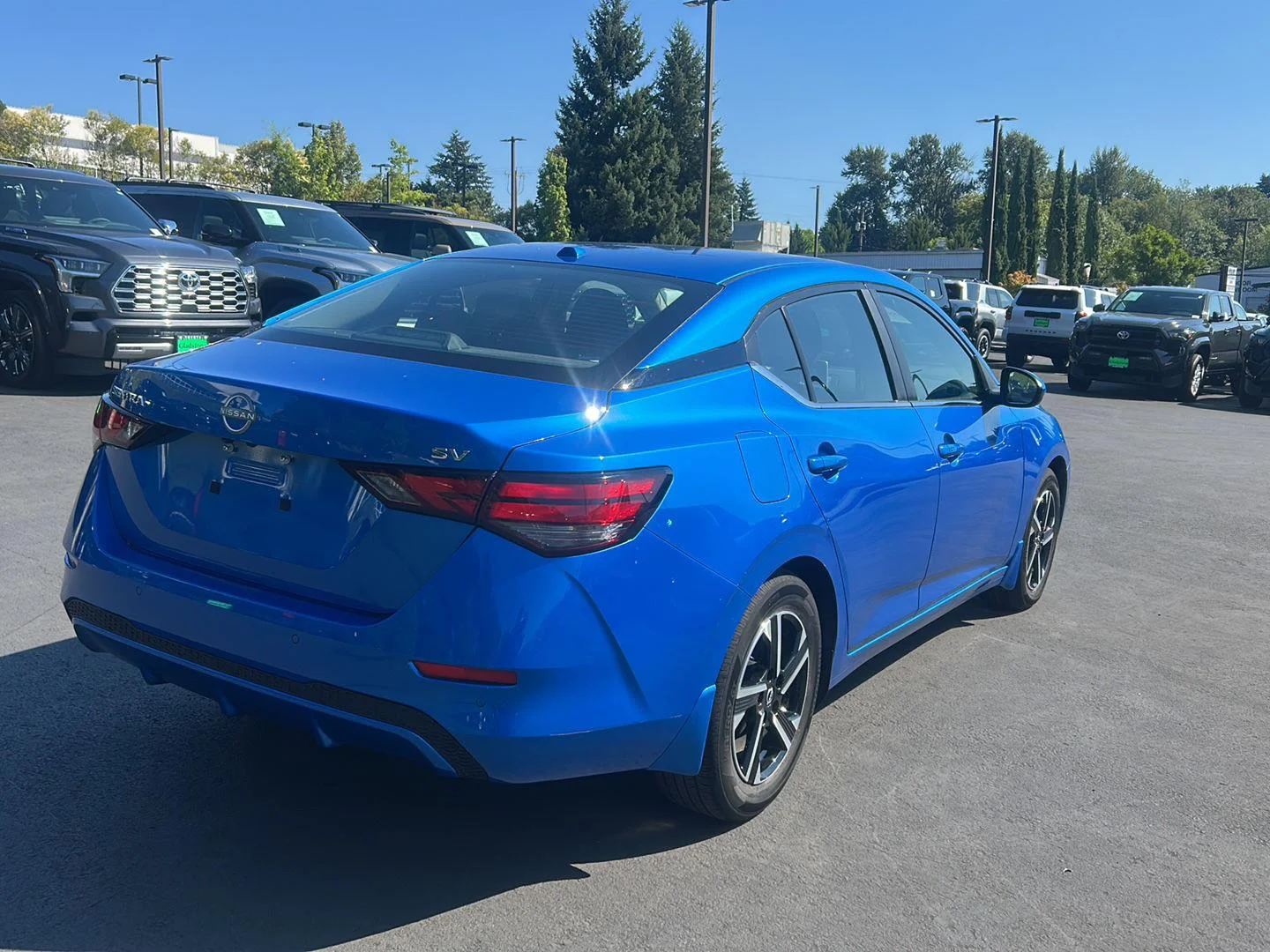 Used 2024 Electric Blue Metallic Nissan SV image 3