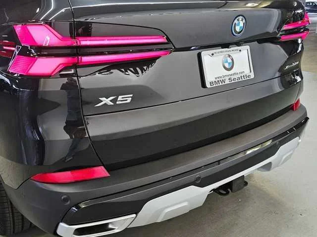 Used 2025 Black Sapphire Metallic BMW xDrive50e image 7