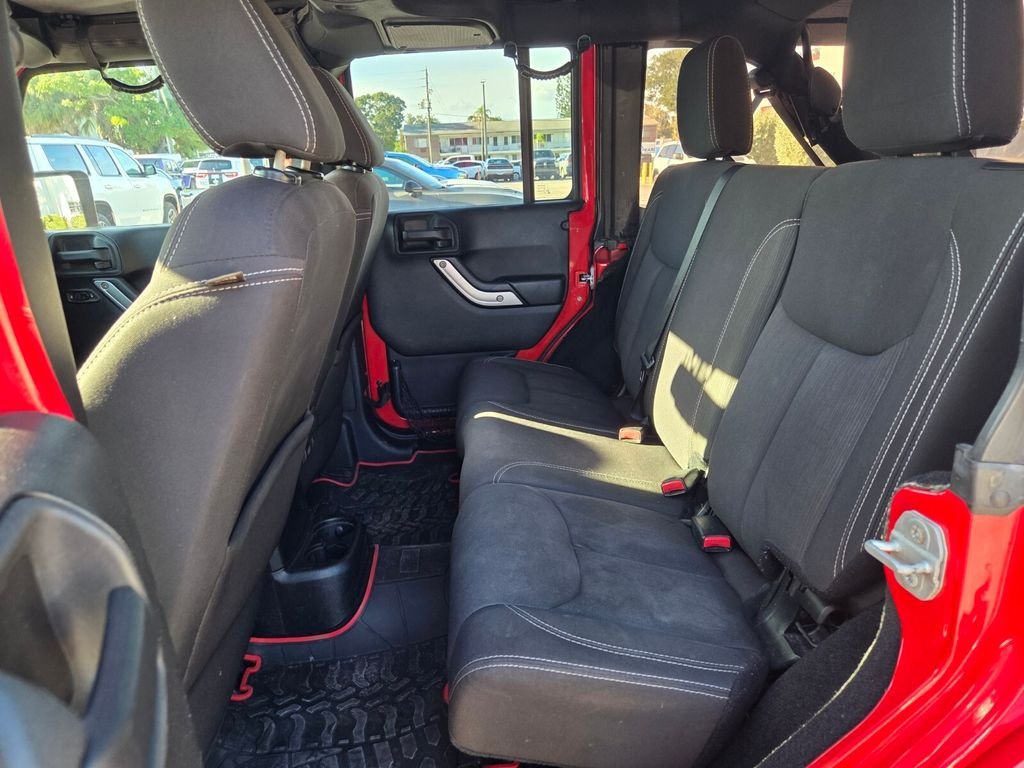 Used 2015 Red Jeep Unlimited Sahara image 12