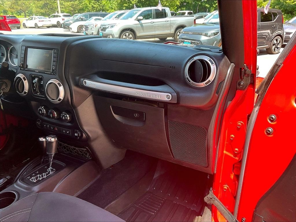 Used 2015 Red Jeep Unlimited Sahara image 13