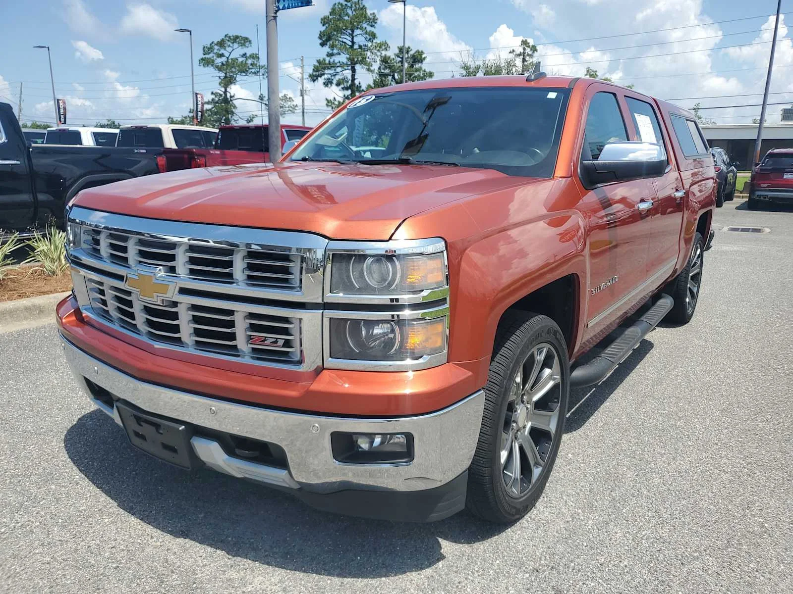 Used 2015 SUNSET ORANGE METALLIC Chevrolet LTZ image 1