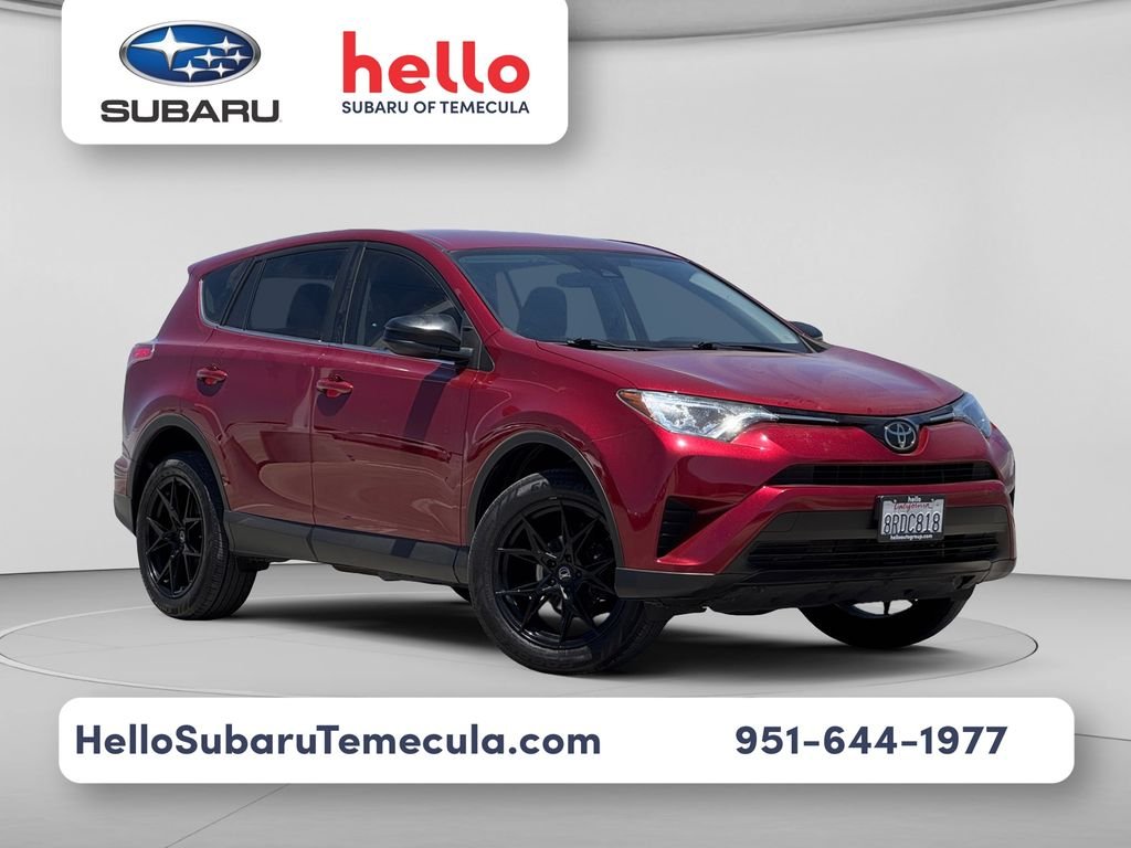 Used 2018 Red Toyota LE image 1