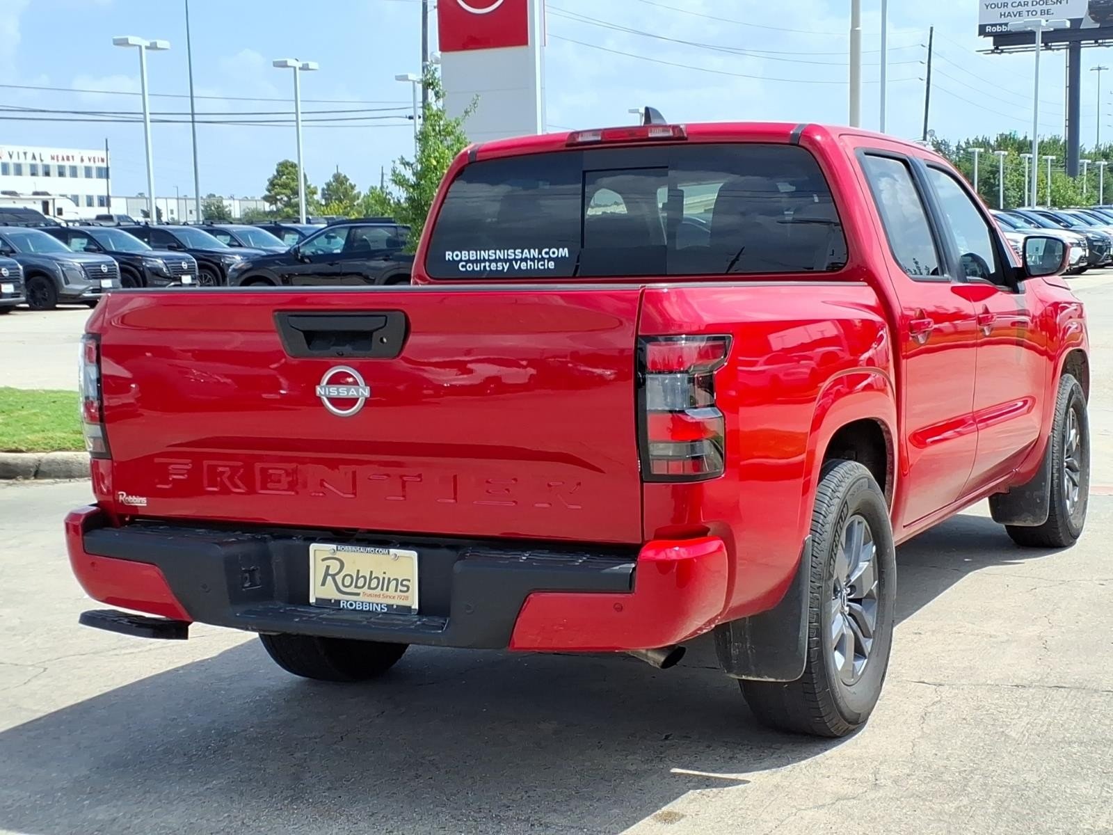 2026 Nissan Frontier SV Red at Robbins Nissan