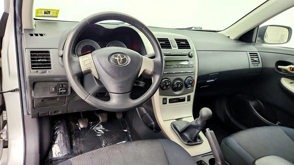 Used 2010 Classic Silver Metallic Toyota 4dr Sedan Manual S w/ Power Moonroof & 16