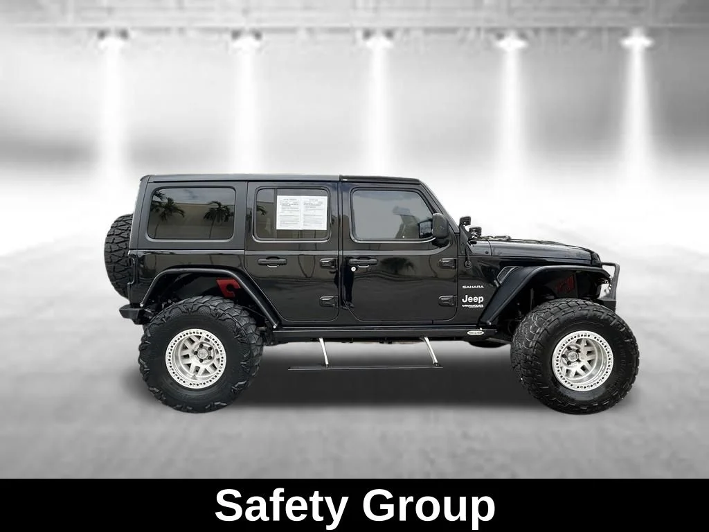Used 2018 Black Jeep Unlimited Sahara image 7
