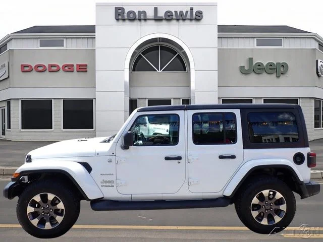 Used 2018 White Jeep Unlimited Sahara image 1