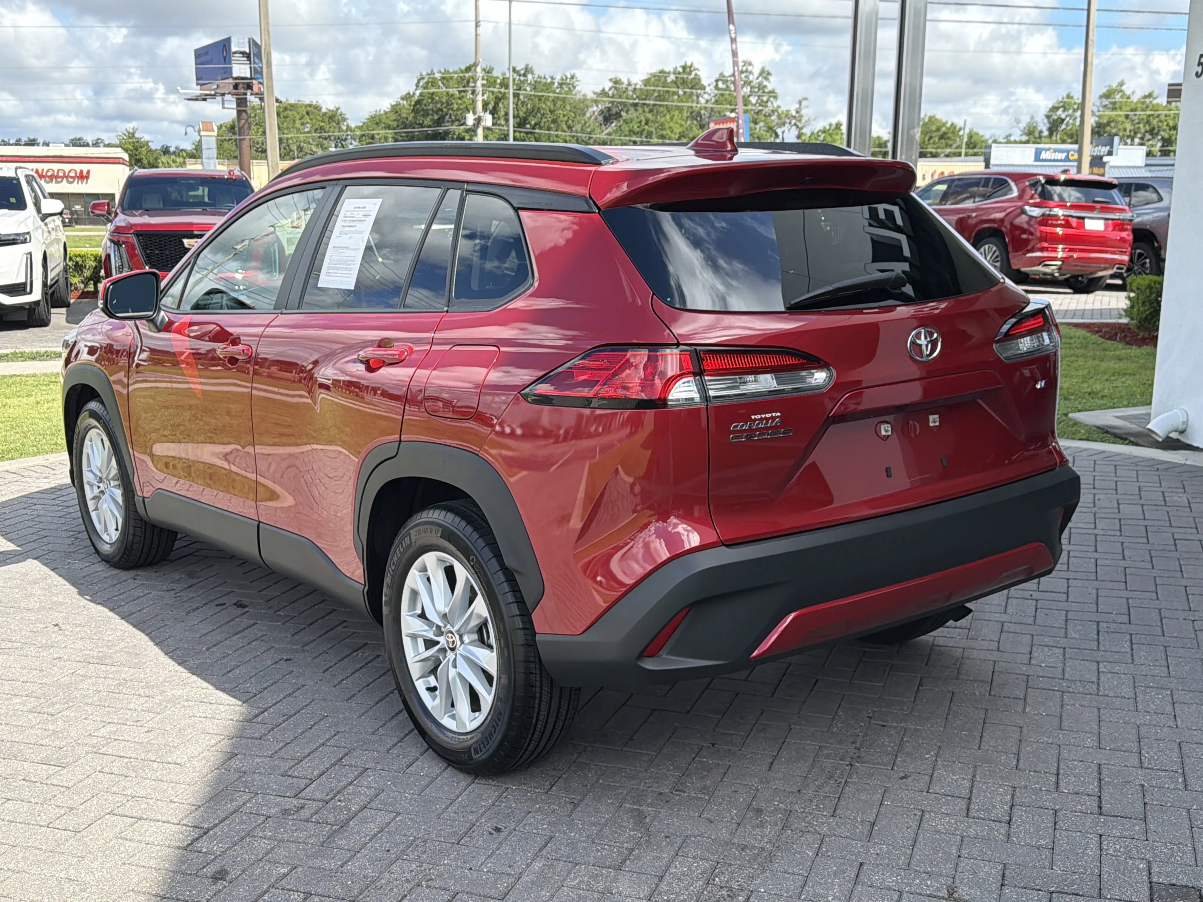 Used 2023 Barcelona Red Metallic Toyota LE image 4