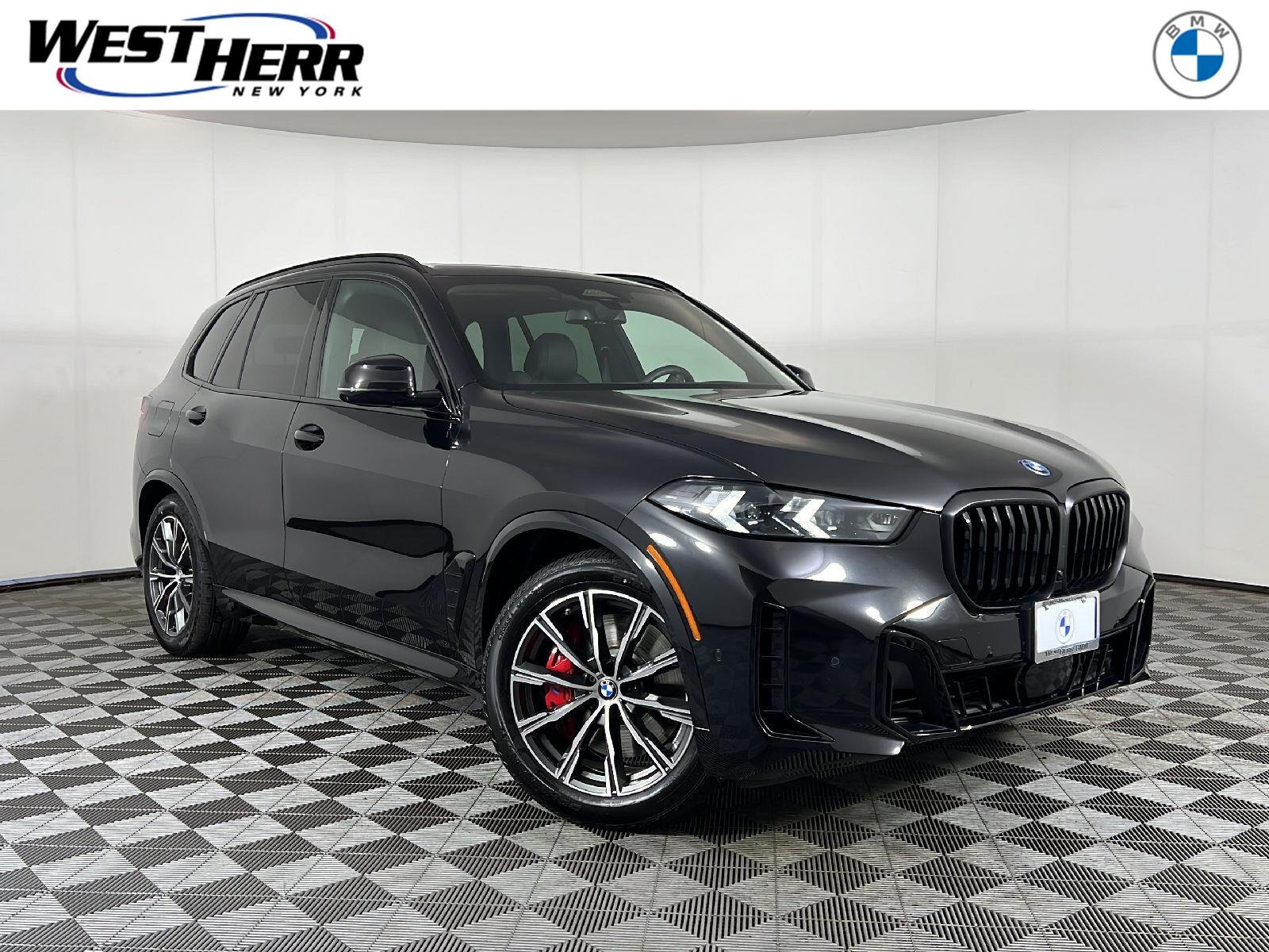 New 2026 Black Sapphire Metallic BMW xDrive50e image 1