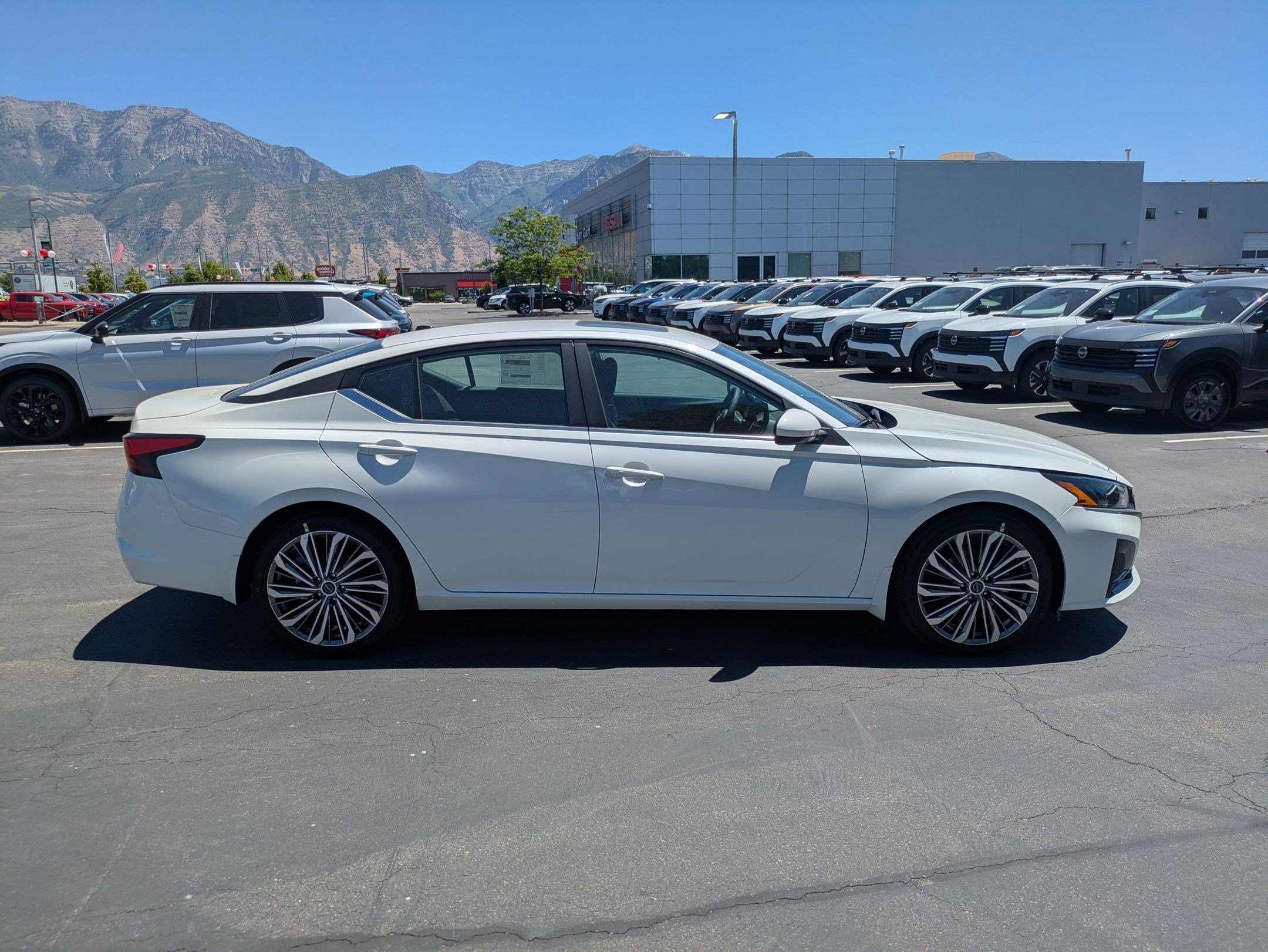 New 2026 Pearl White Tricoat Nissan SV image 2
