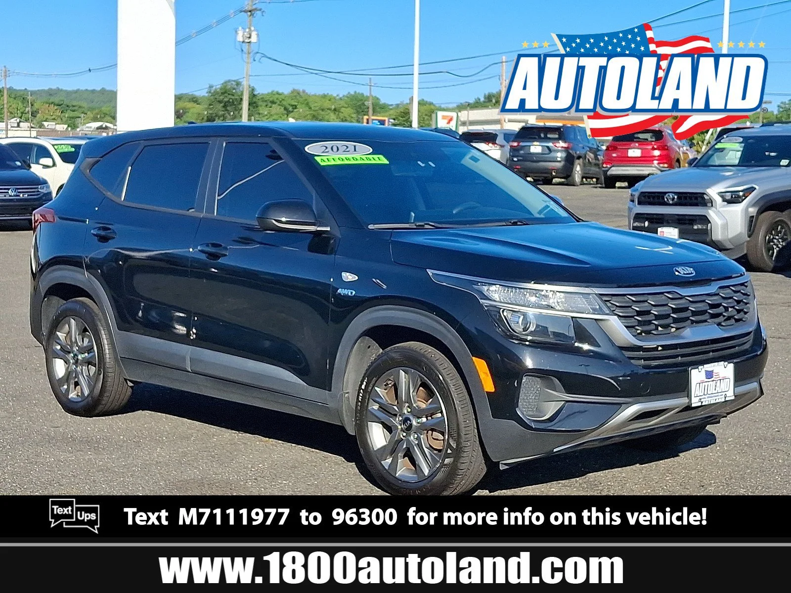 Used 2021 Cherry Black Kia LX image 1