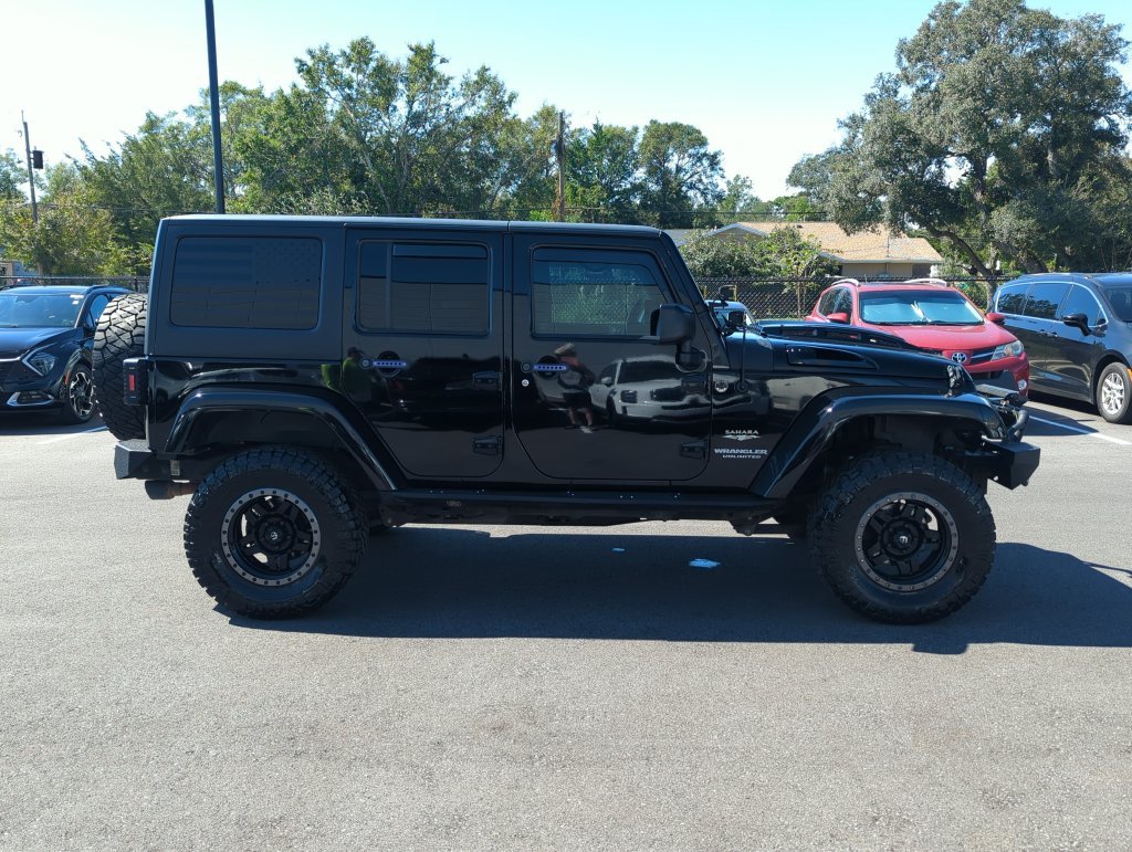 Used 2015 Black Jeep Unlimited Sahara image 8