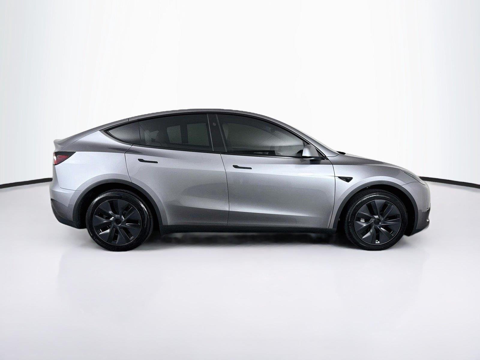 Used 2025 Tesla Model Y Long Range with VIN 7SAYGDEE0SF234365 for sale in Cumming, GA