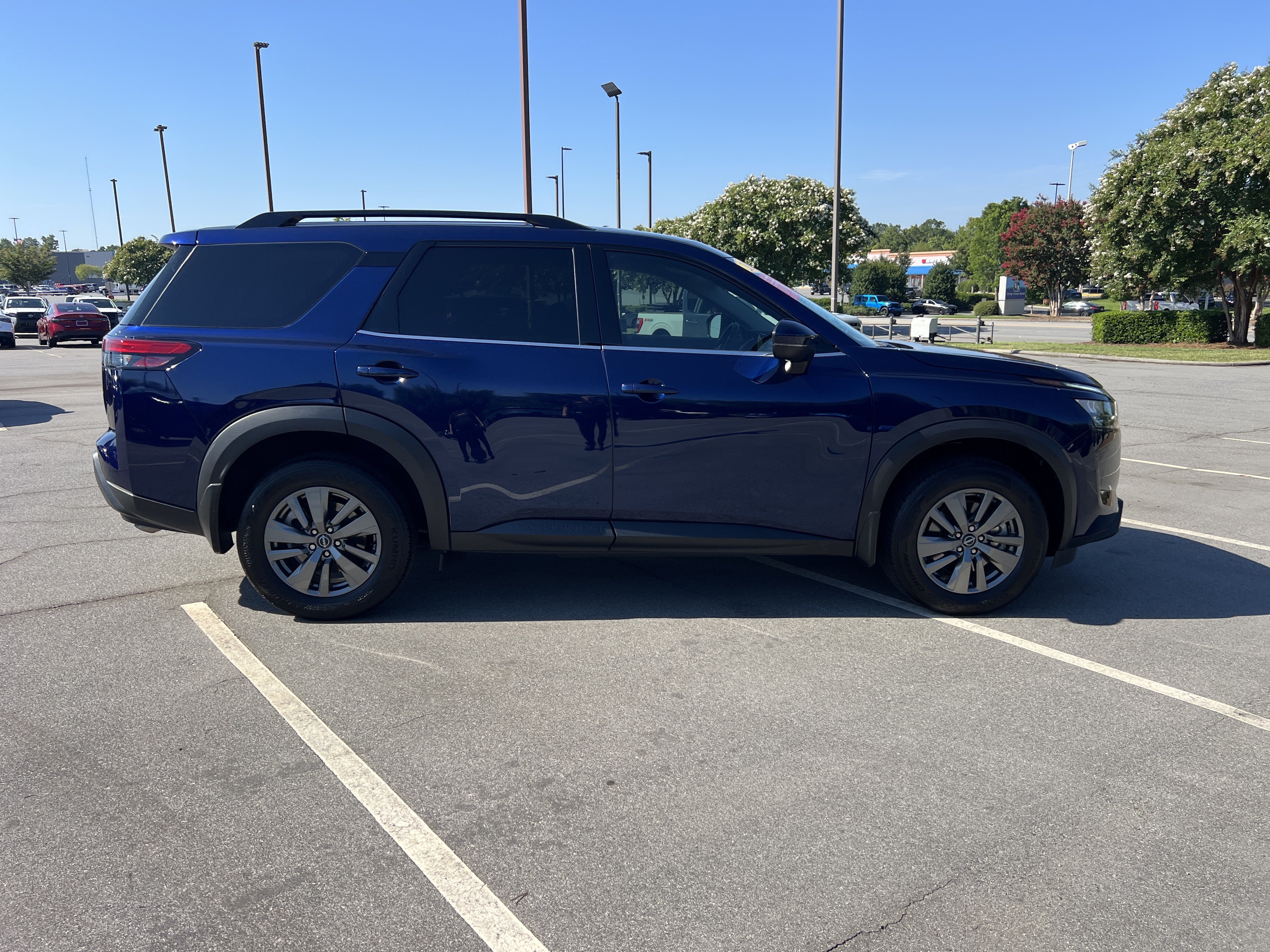 Used 2025 Deep Ocean Blue Pearl Nissan SV image 4