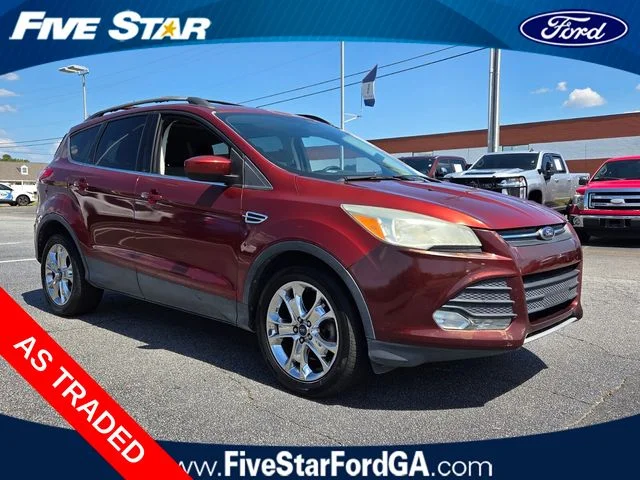Used 2014 Orange Ford SE image 1