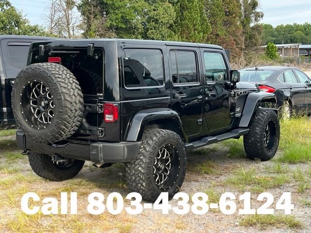 Used 2017 Black Jeep Unlimited Sahara image 2