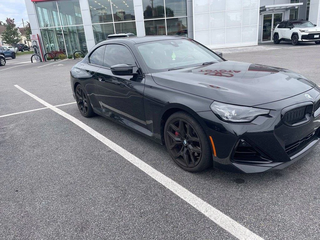 Used 2025 Black Sapphire Metallic BMW M240i image 1