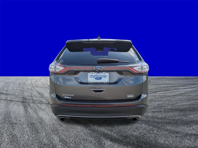 Used 2016 Magnetic Metallic Ford SEL image 5